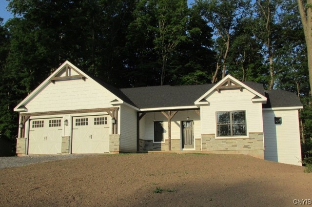 craftsman inspired home with a garage