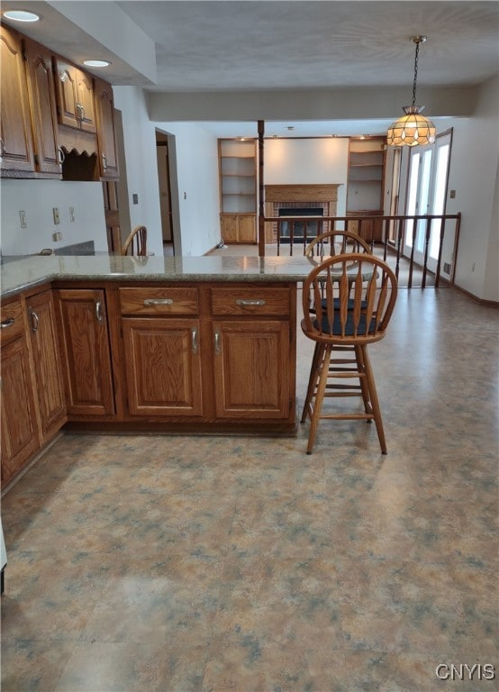 kitchen with hanging light fixtures and kitchen peninsula