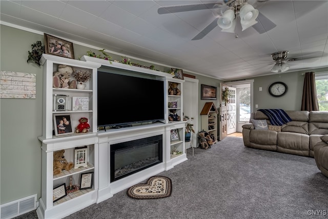 living room featuring carpet floors and ceiling fan