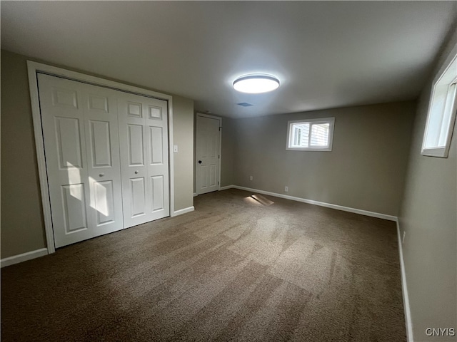 unfurnished bedroom featuring a closet and carpet floors