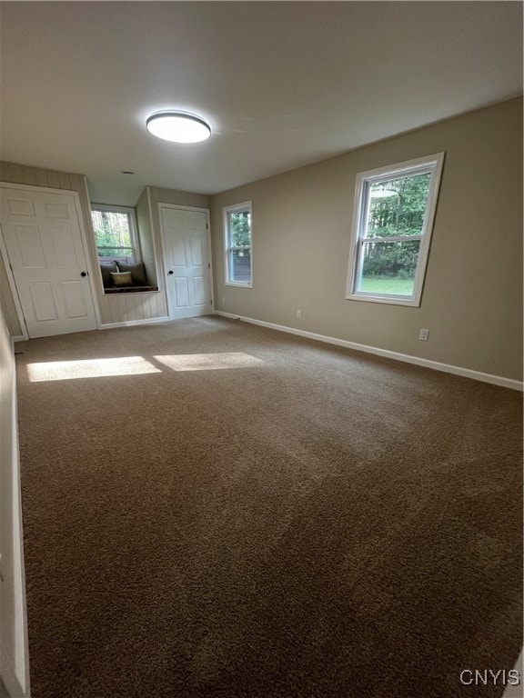 unfurnished living room featuring carpet