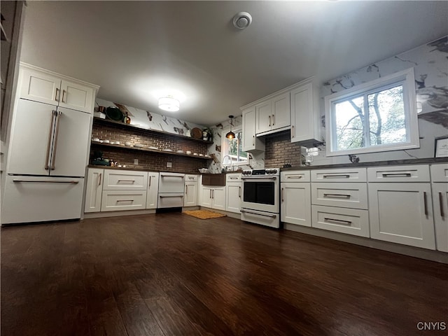 kitchen featuring white cabinetry, tasteful backsplash, white built in refrigerator, dark hardwood / wood-style flooring, and electric range