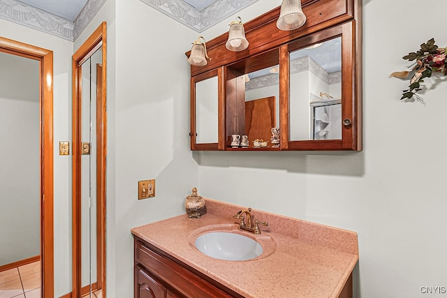 bathroom with tile patterned flooring and vanity