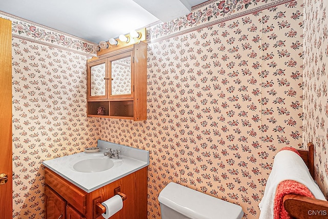 bathroom with vanity and toilet