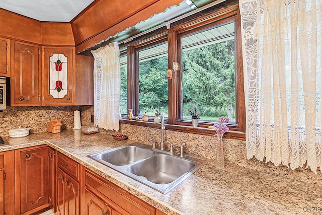 kitchen featuring sink and tasteful backsplash