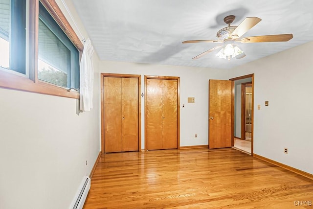 unfurnished bedroom with ceiling fan and light hardwood / wood-style floors