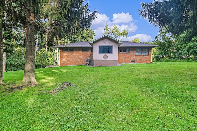 back of house with a yard