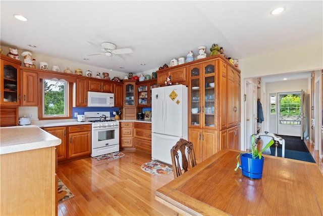 15043 State Route 54th Rd, Wayne, NY 14837 - kitchen featuring white appliances, light countertops, recessed lighting, glass insert cabinets, and light wood-type flooring