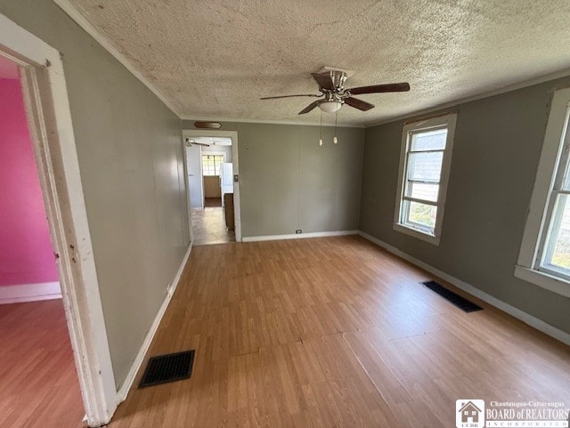 512 N 7th St, Olean-City, NY 14760 - empty room with a textured ceiling, a ceiling fan, wood finished floors, and visible vents