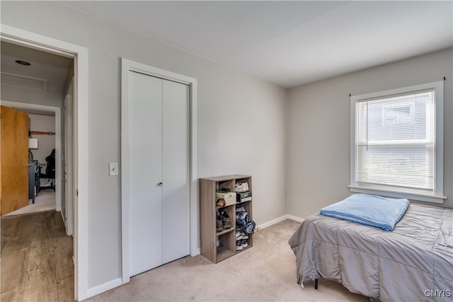 bedroom featuring light colored carpet