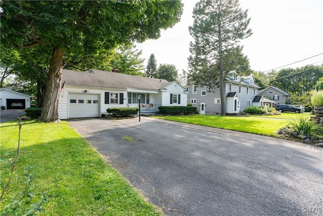 view of front of house with a front lawn and a garage