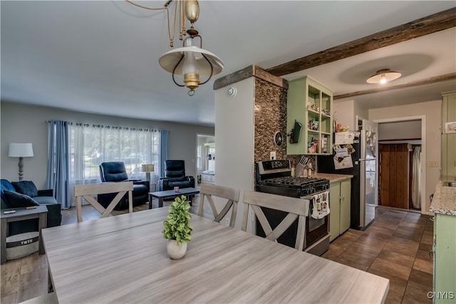 dining area featuring dark tile patterned floors