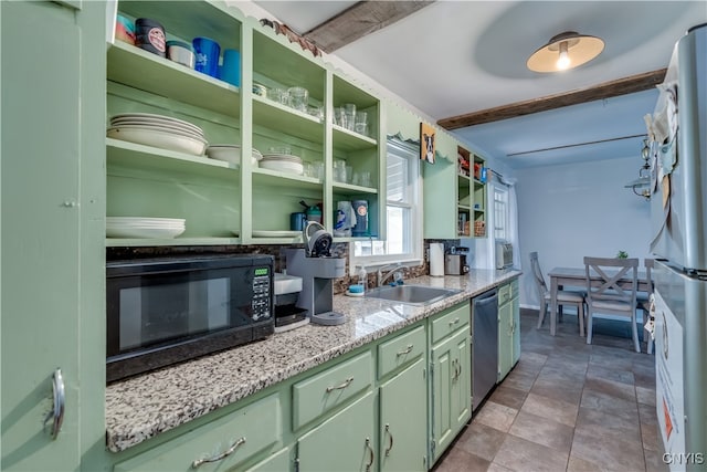 kitchen with light tile patterned floors, beam ceiling, sink, and fridge