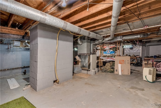 basement featuring heating unit