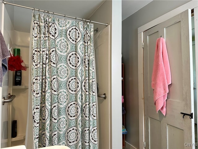 bathroom with a shower with shower curtain