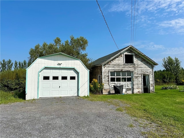 garage featuring a lawn