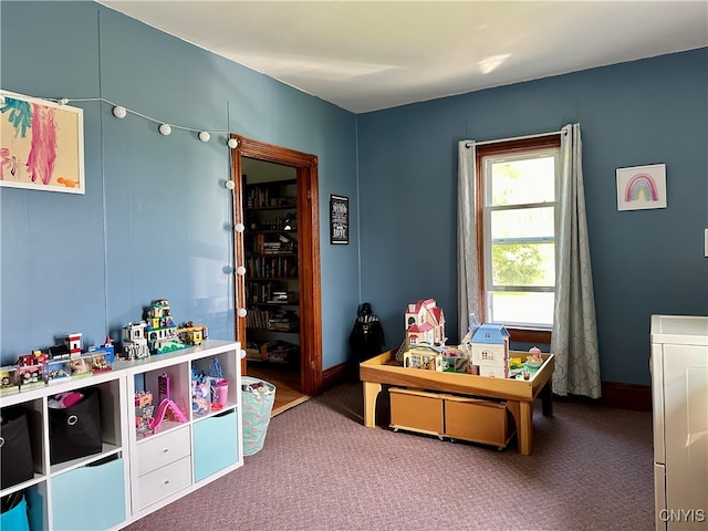 rec room featuring washer / dryer and carpet flooring