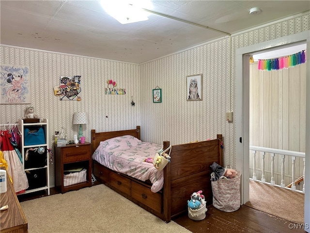 bedroom with hardwood / wood-style floors