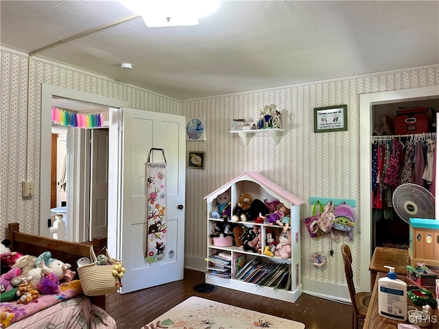 bedroom featuring a closet and dark hardwood / wood-style flooring