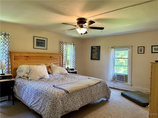 carpeted bedroom with ceiling fan and cooling unit