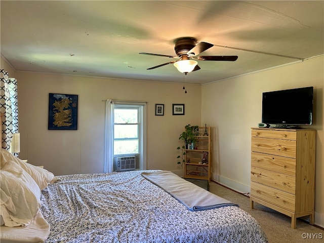 carpeted bedroom featuring ceiling fan and cooling unit