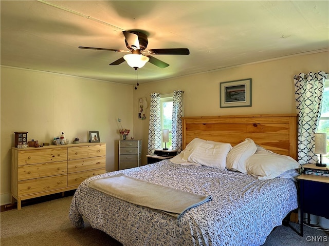 bedroom with ceiling fan and carpet flooring