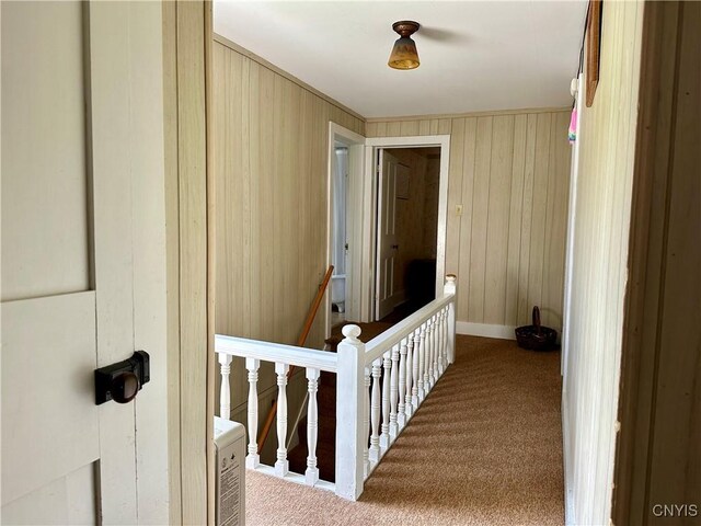 hallway with light colored carpet