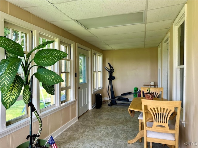 sunroom / solarium featuring a paneled ceiling