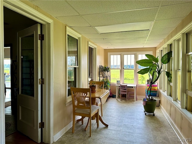 sunroom / solarium featuring a paneled ceiling