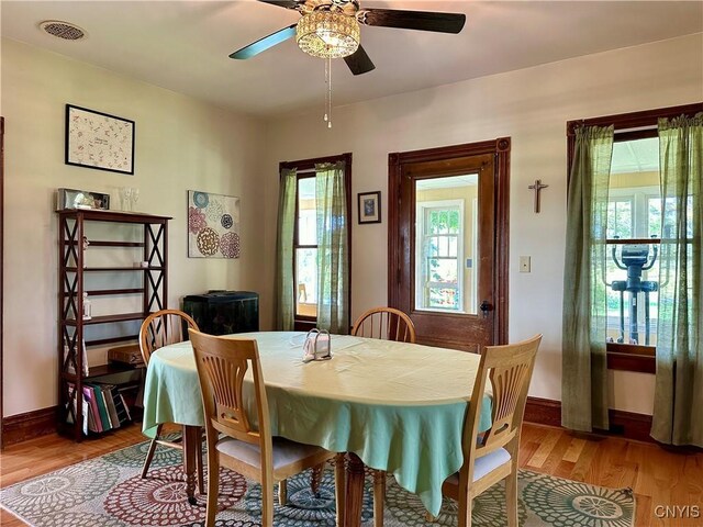 dining room featuring ceiling fan, plenty of natural light, and light hardwood / wood-style flooring