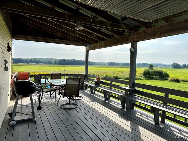 wooden terrace featuring a rural view