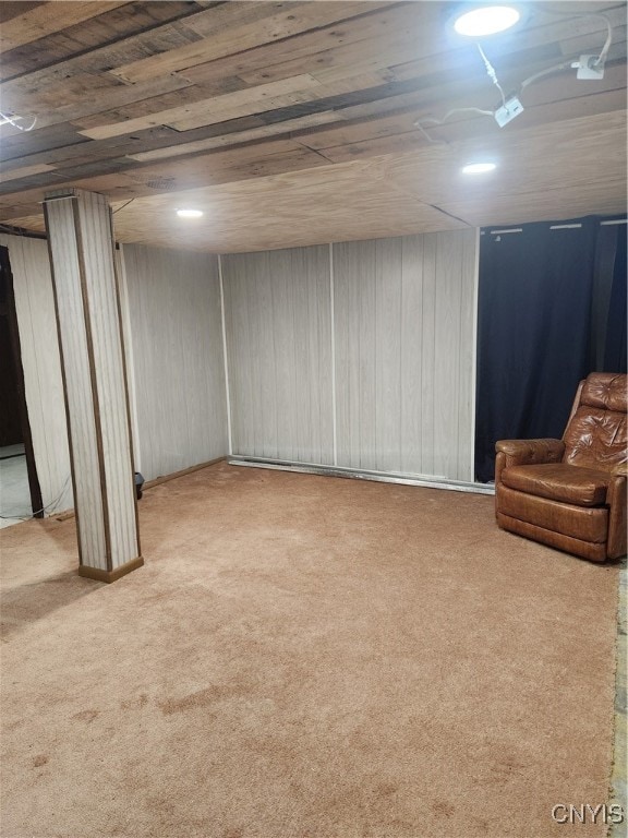 basement featuring wooden ceiling and light colored carpet