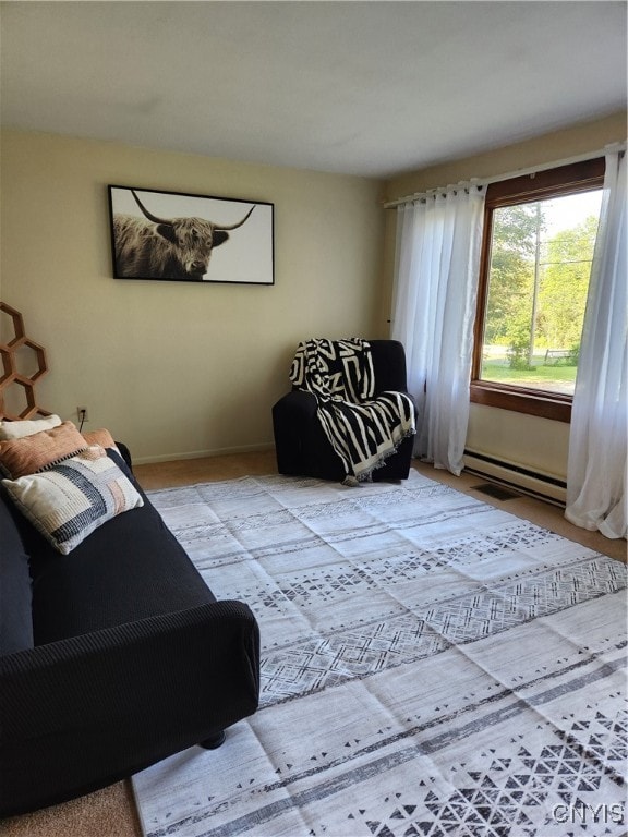 living room featuring a baseboard heating unit