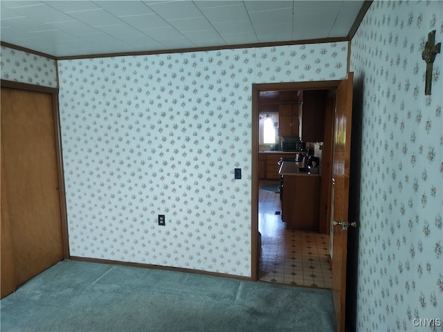 interior space featuring tile patterned flooring and crown molding