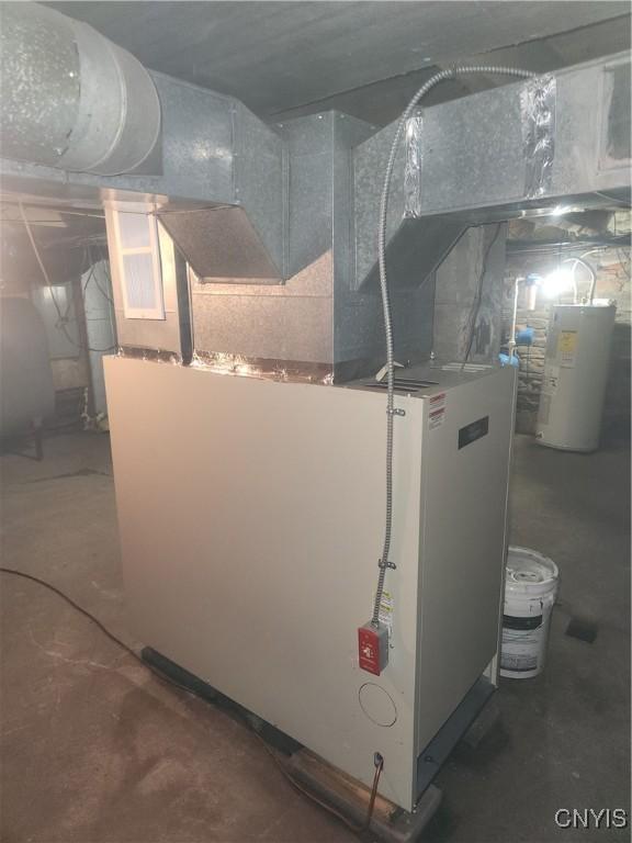 utility room with electric water heater