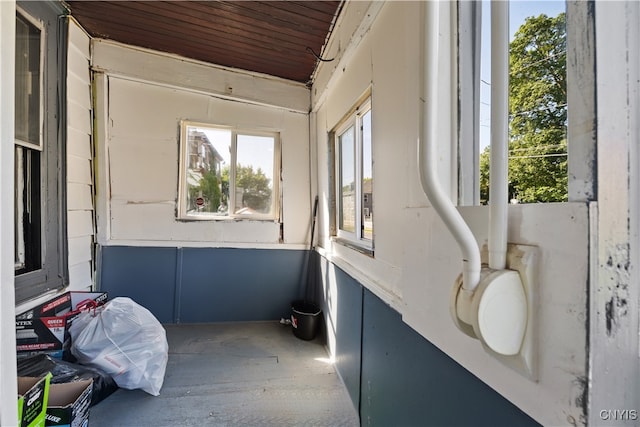 sunroom featuring wood ceiling