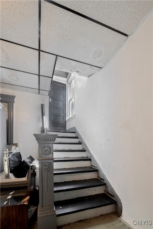 staircase with a drop ceiling