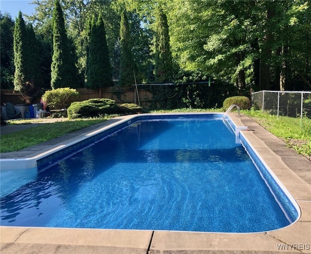 view of swimming pool with a fenced in pool and a fenced backyard