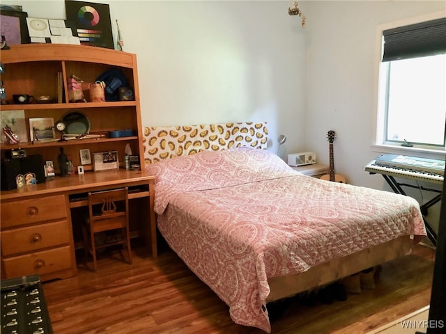 bedroom featuring wood finished floors