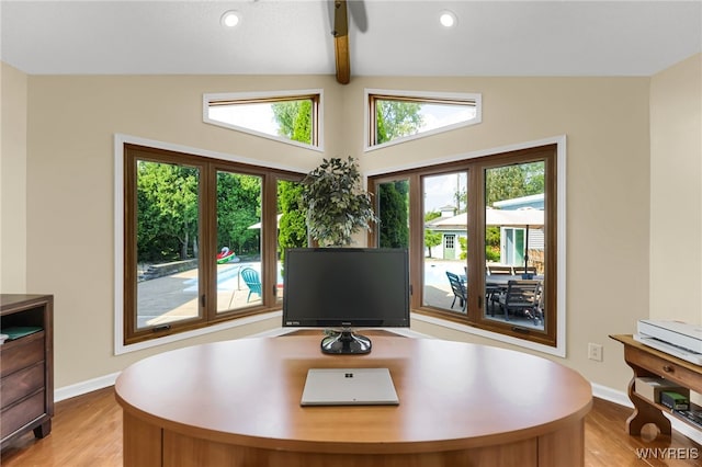 office area with vaulted ceiling with beams and light hardwood / wood-style flooring