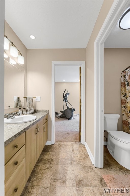 bathroom with toilet and vanity