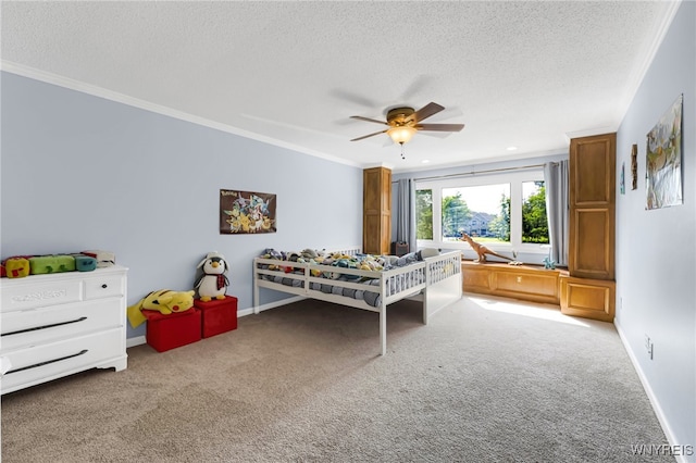 bedroom with ornamental molding, carpet, a textured ceiling, and ceiling fan