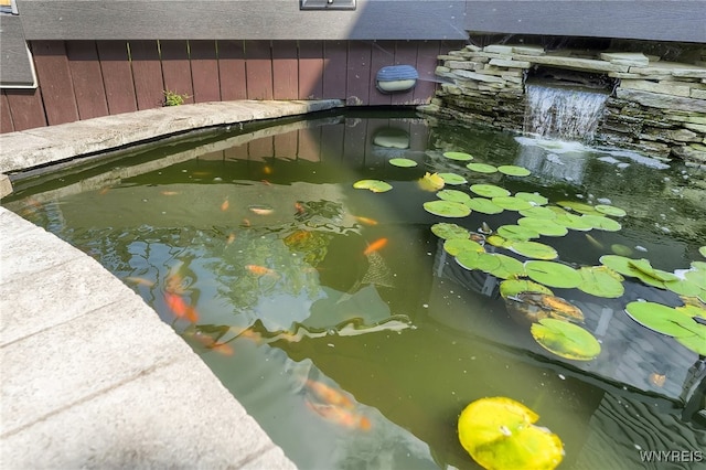 details with a textured ceiling and a garden pond