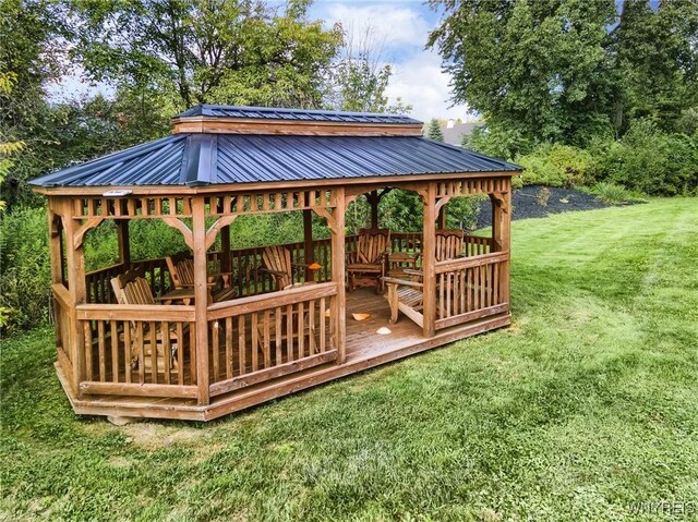 exterior space with a gazebo and a lawn