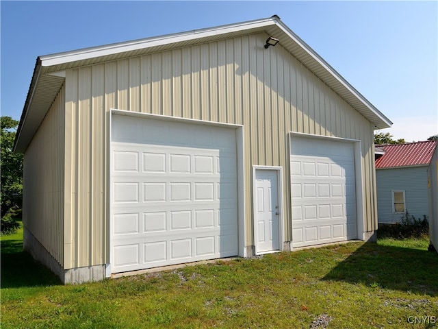 garage featuring a lawn