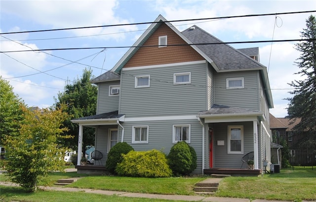 front facade with a front lawn and central AC