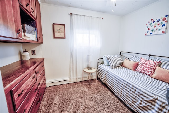 bedroom with baseboard heating and carpet flooring