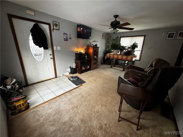 living room with ceiling fan and light colored carpet