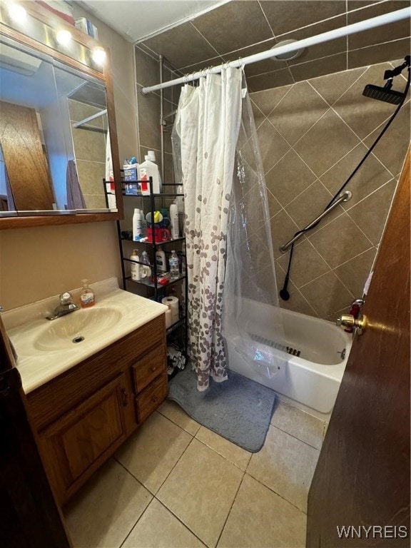 bathroom featuring shower / bath combo, tile patterned flooring, and vanity