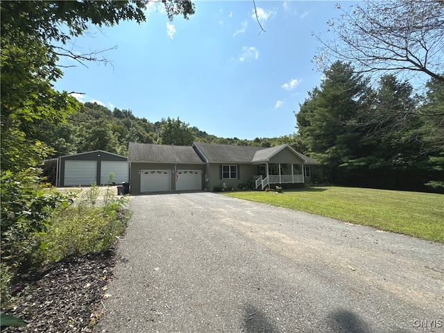 ranch-style home with a front yard and a garage